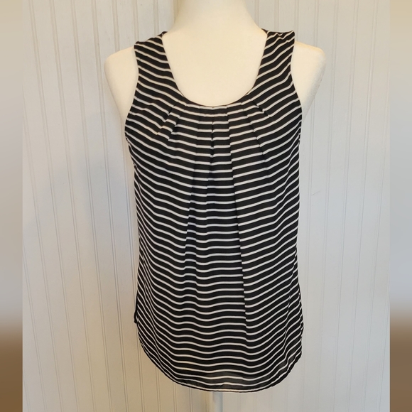 Elle size small black with white stripes on the front and a button in back - Picture 1 of 3